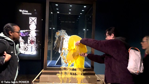 Custard splashed across the Crown Jewels display case during the Tower of London protest by Take Back Power