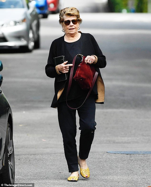 Jennifer Warren striding through Los Angeles in an all-black outfit, April 2026