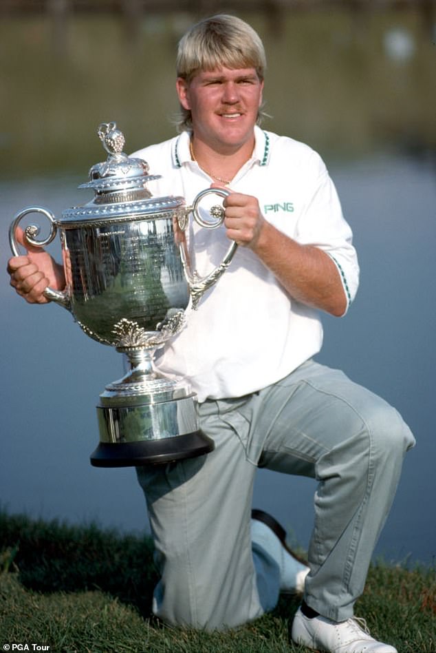 John Daly at a golf event holding a trophy