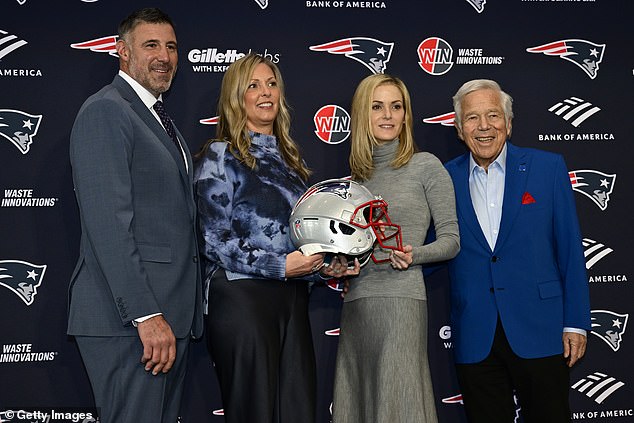 Owner Robert Kraft and his wife Dana Blumberg pose for a photograph with Mike Vrabel and his wife Jen Vrabel as Vrabel is announced as head coach of the New England Patriots