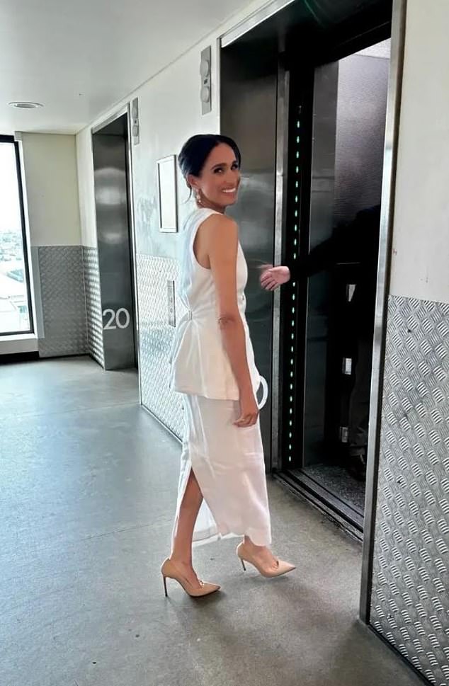 Meghan Markle in a white Posse linen vest and skirt with Paspaley opal and pearl earrings at Harry's InterEdge summit appearance