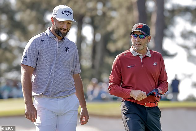 Sergio Garcia and Jon Rahm walk together at Augusta after both made the cut.