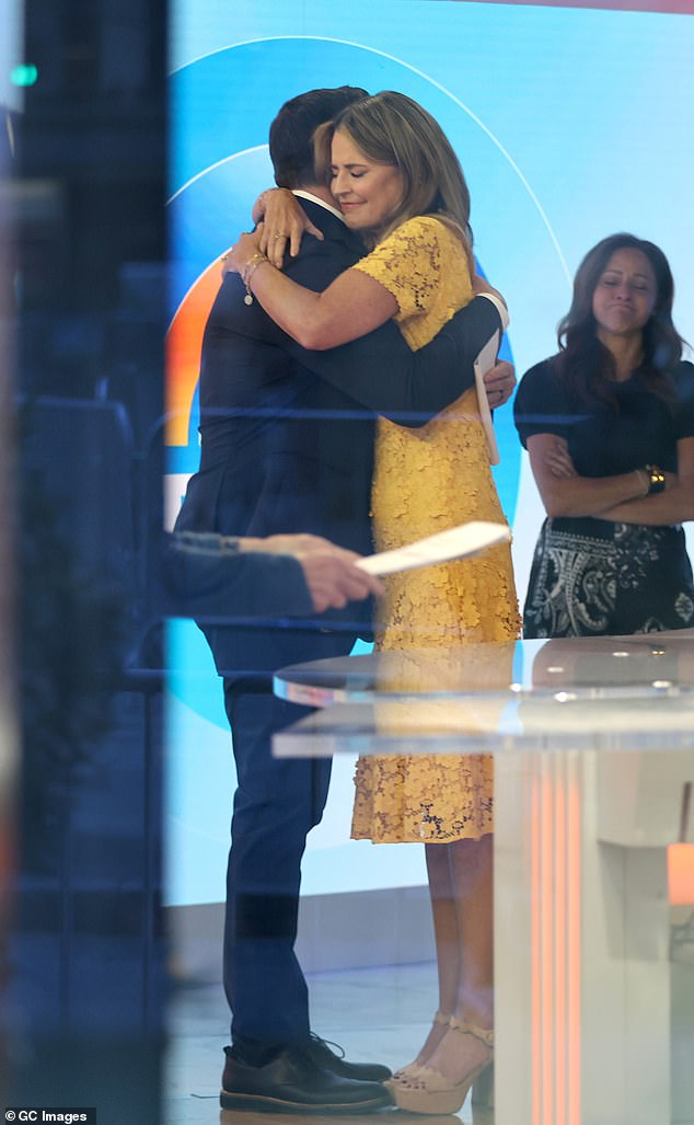 Savannah Guthrie hugs co-host Carson Daly during her return to Today