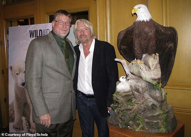 Floyd Scholz and Richard Branson are pictured with The Queen of Champlain, a bald eagle and chick sculpture regarded as one of Scholz's masterworks