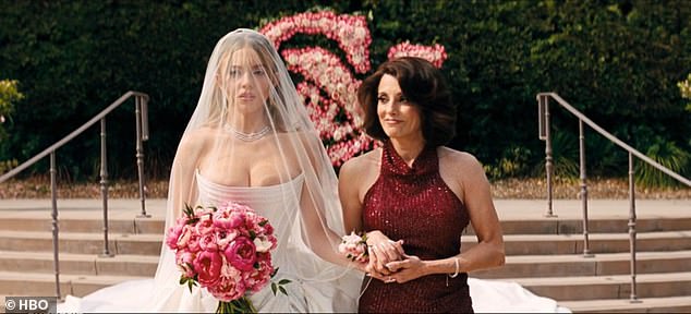 Cassie walks down the aisle with her mother Suze