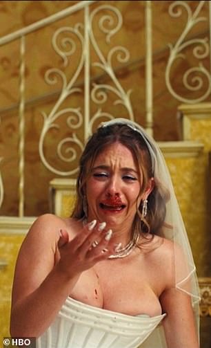 A distraught Cassie with a bloody nose on her wedding night
