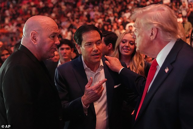 Donald Trump talks with Secretary of State Marco Rubio and UFC president Dana White cage-side in Miami.