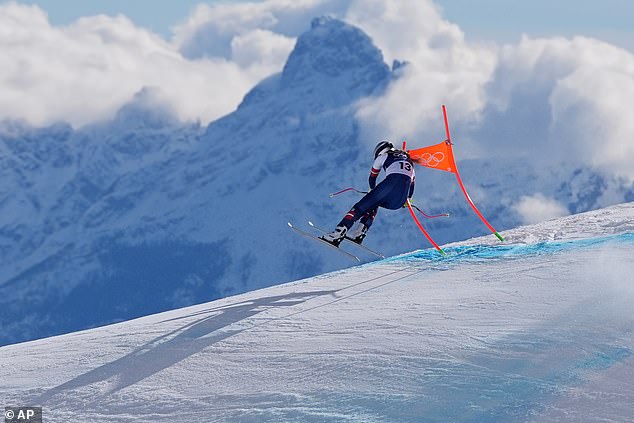 Lindsey Vonn clips a gate during her Olympic downhill, leading to a violent crash and broken leg.