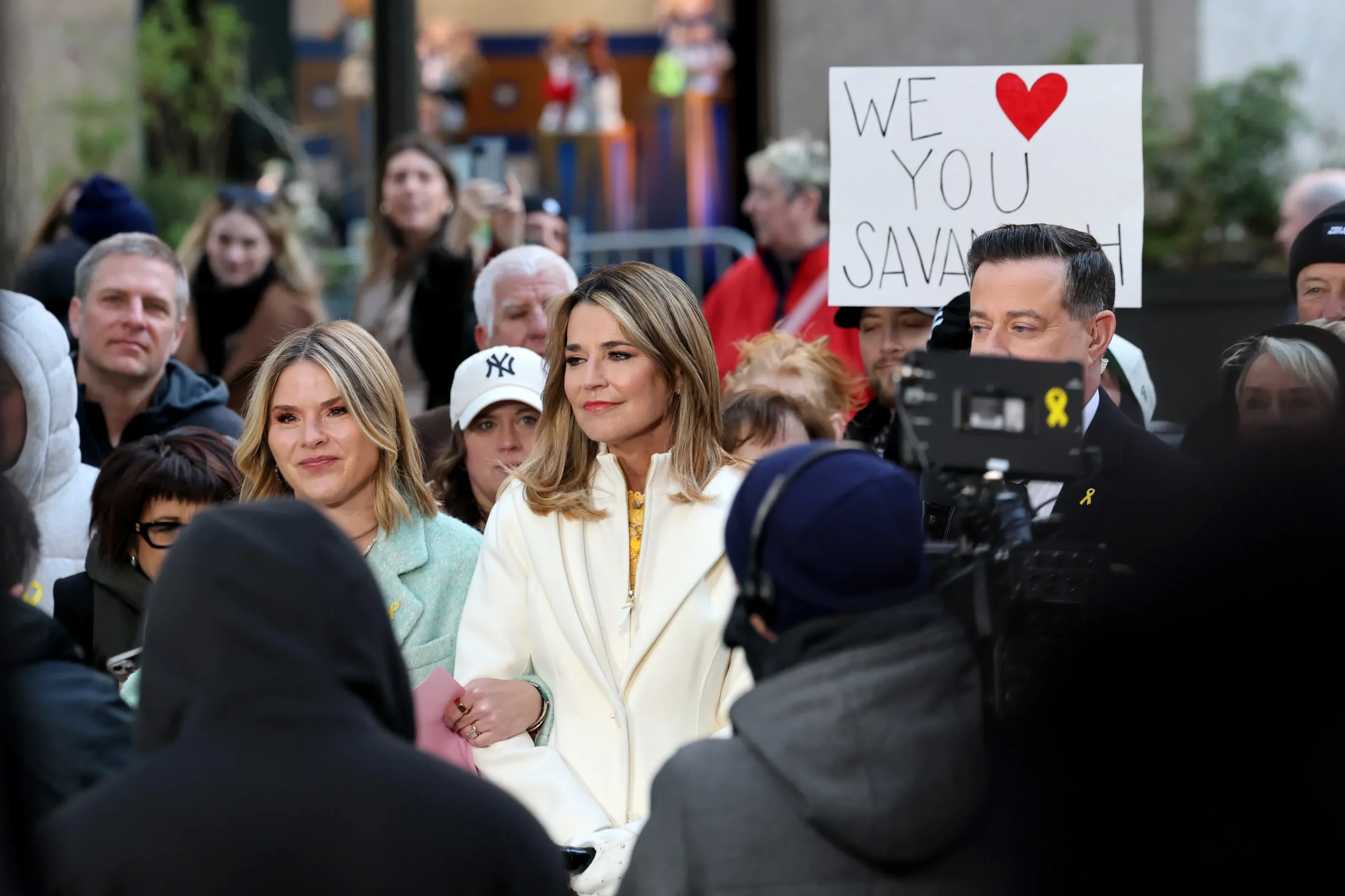 Savannah Guthrie wipes away a tear while greeting fans on the Today plaza.