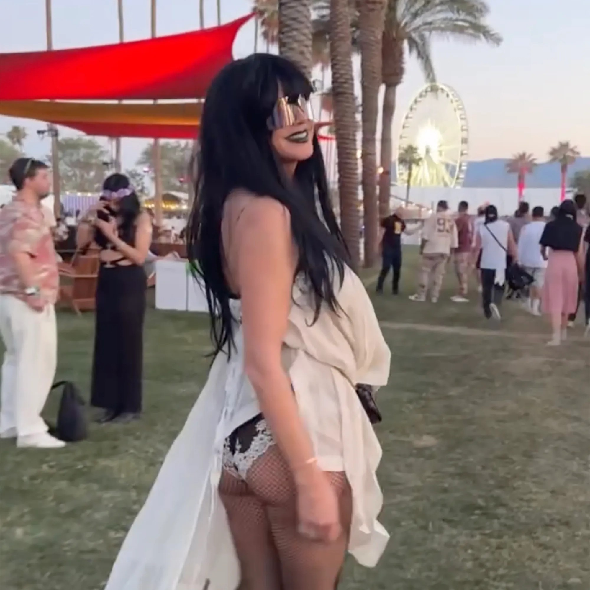 The supermodel sported a flowing strapless dress, fishnet tights and cowboy boots. - heidiklum/instagram