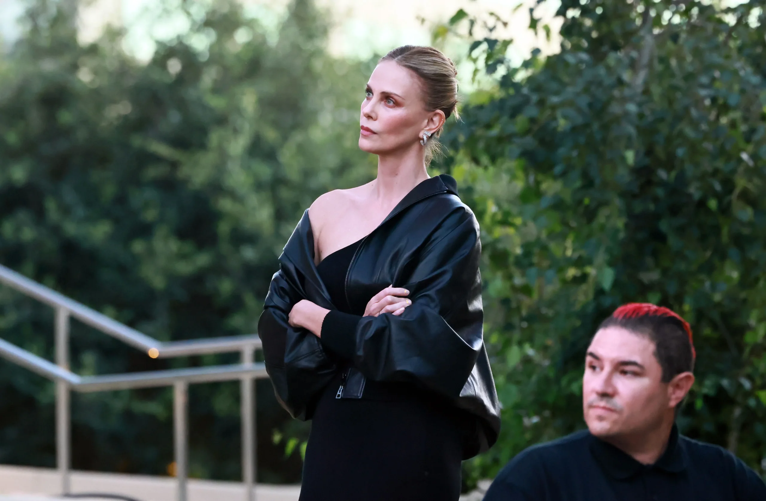 Charlize Theron speaking onstage at her Africa Outreach Project event.