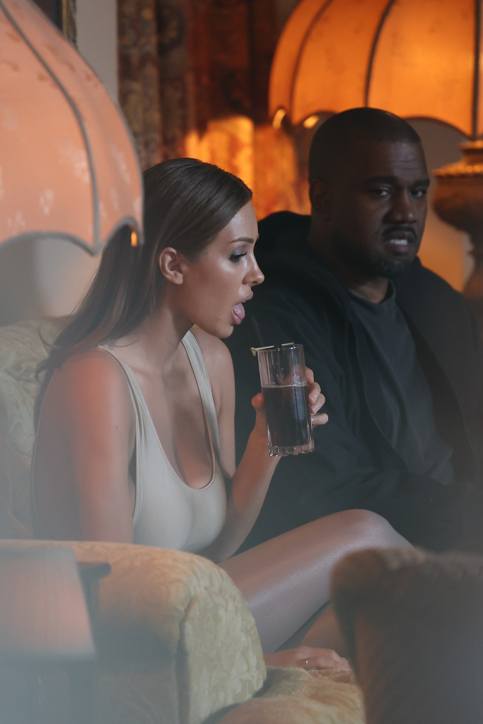 Bianca Censori drinks beside Kanye West during their Chateau Marmont night out.