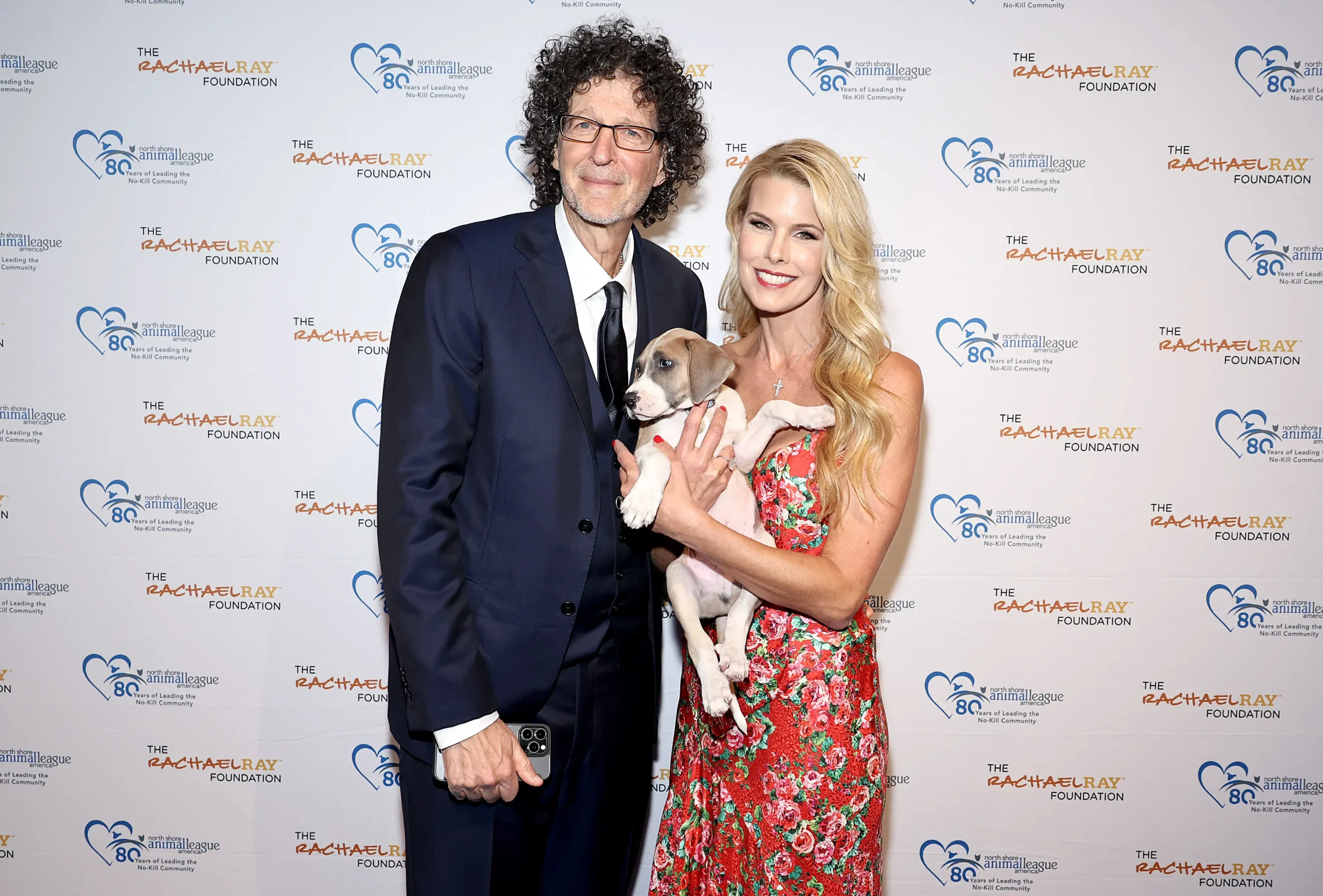 Howard Stern and Beth Stern hold a puppy at North Shore Animal League America's 2024 Celebration of Rescue.