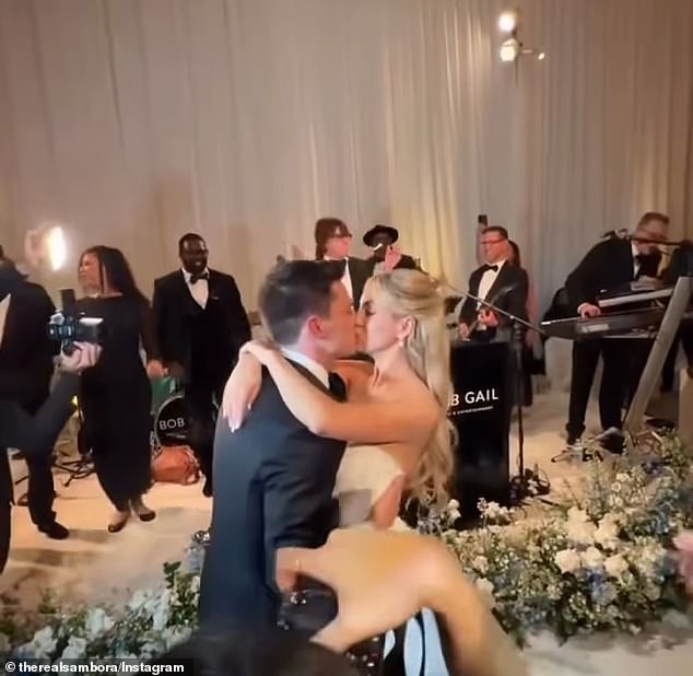 Newlyweds Ava Sambora and Tyler Farrar share a kiss at their coastal California wedding reception