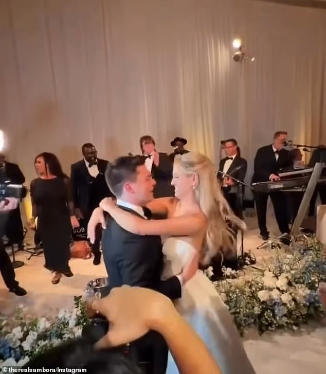 Ava Sambora and Tyler Farrar dance as guests sing along to Bon Jovi's Livin' On A Prayer