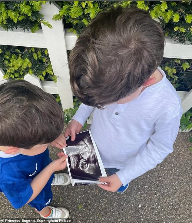 Ernest, in a Chelsea kit, and August hold a baby scan in Princess Eugenie's announcement photo