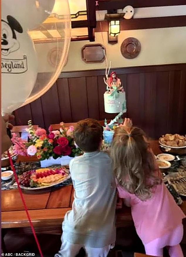 Archie and Lilibet pictured at a birthday celebration; the siblings gained the right to royal titles after King Charles acceded to the throne.