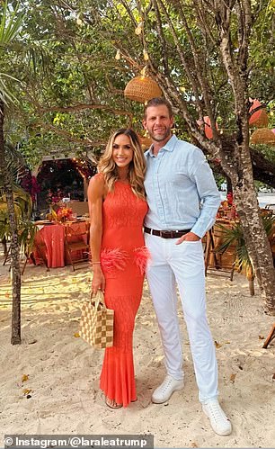 Lara and Eric Trump pose on the beach ahead of the reception on Norman's Cay