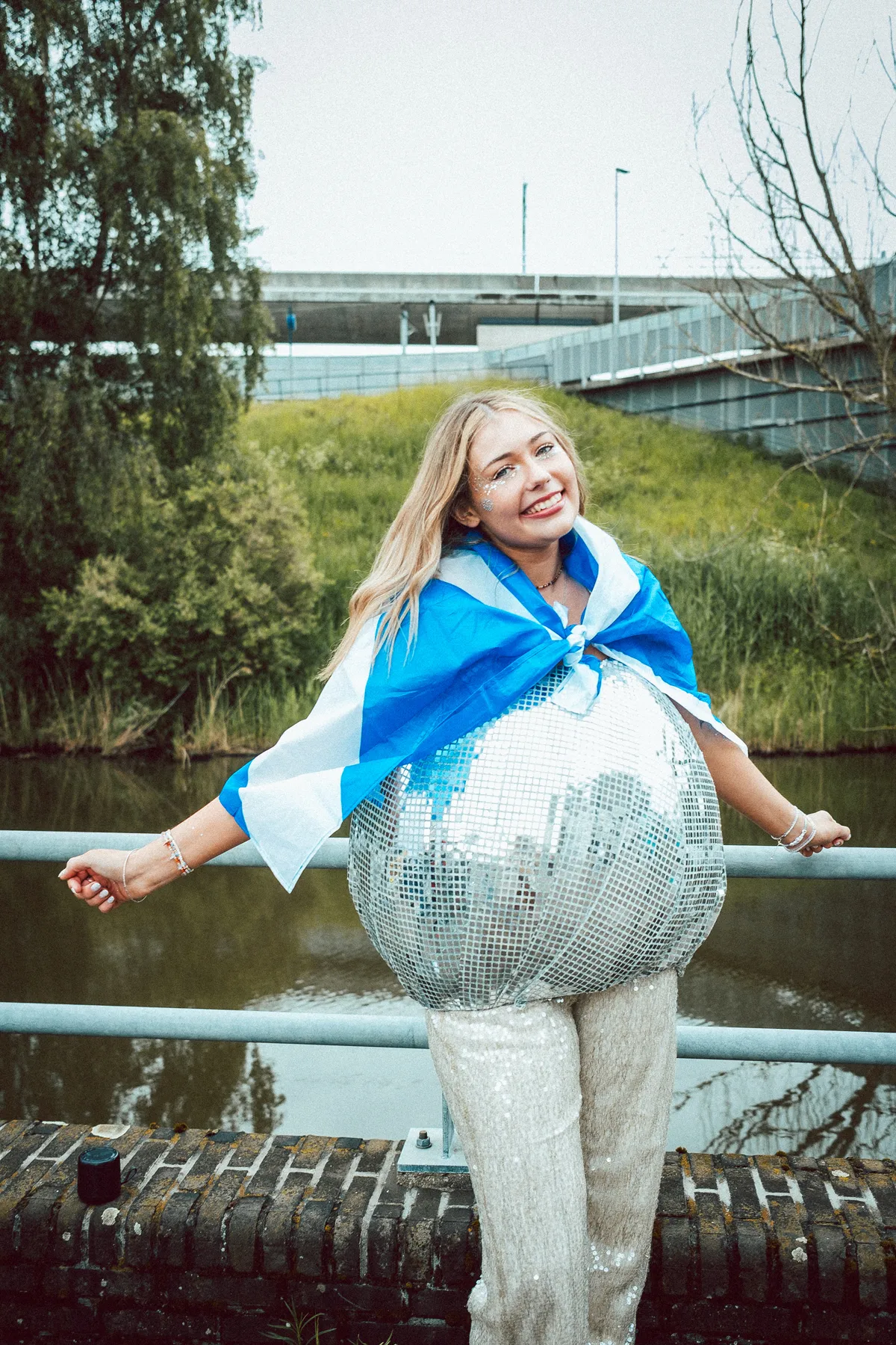 Fan dressed like a disco ball at the Amsterdam kickoff, channeling the tour's retro sparkle.