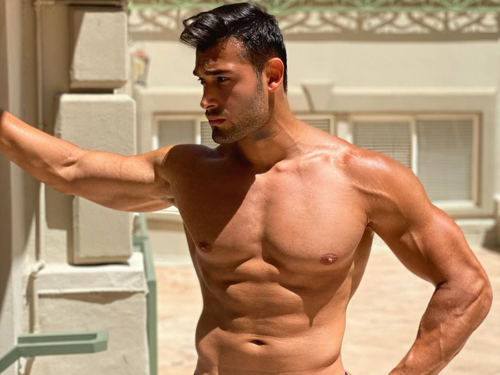 Sam Asghari shirtless portrait against a neutral background
