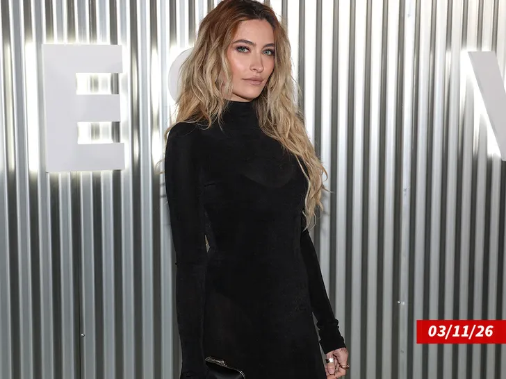 Paris Jackson on a red carpet, smiling and composed