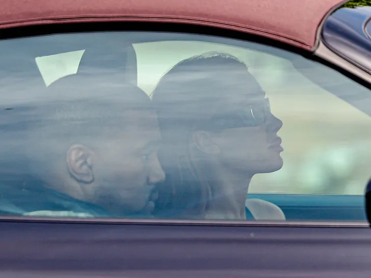 Bianca Censori and Kanye West seen in their car after the spa visit, with Kanye in the passenger seat.