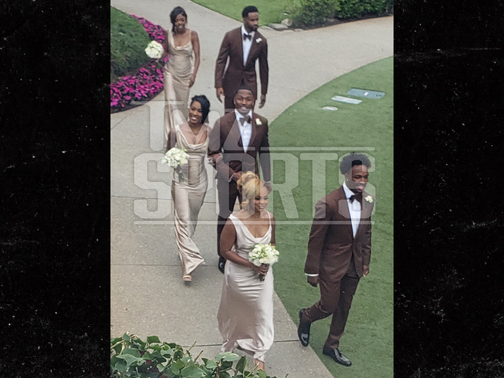 Wedding party in coordinated brown and earth tones at A.J. Brown and Kelsey Riley's Laguna Beach ceremony