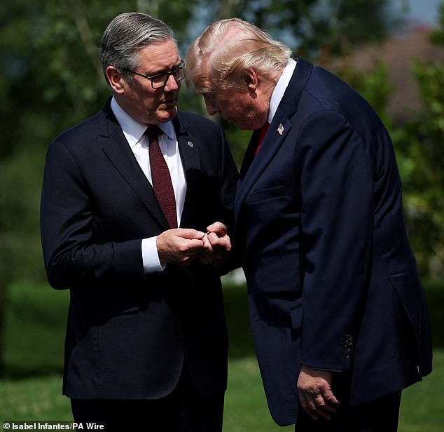 Donald Trump and Keir Starmer speak during the G7 summit in Evian, France