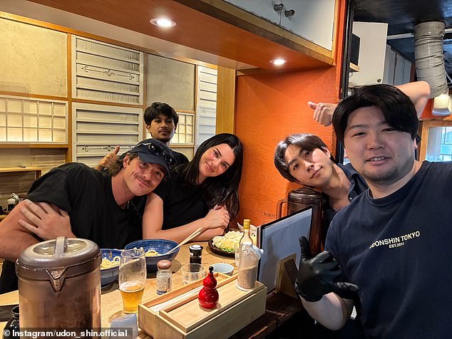 Kendall Jenner and Jacob Elordi pose with fans at an intimate restaurant in Tokyo.