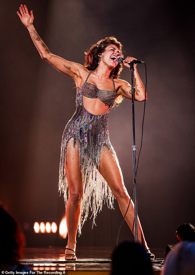 Miley Cyrus performing on stage during a concert
