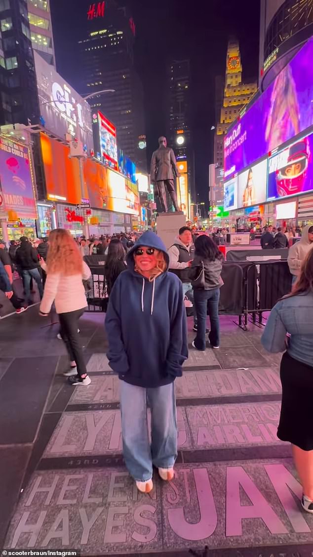Sydney Sweeney takes in Times Square during a late-night date filmed by Scooter Braun