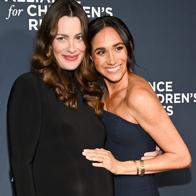 The Duchess of Sussex's 'Maj Squad' appears to have recruited a new member, Kelly McKee Zajfen (pictured together in March) - Daily Mail US
