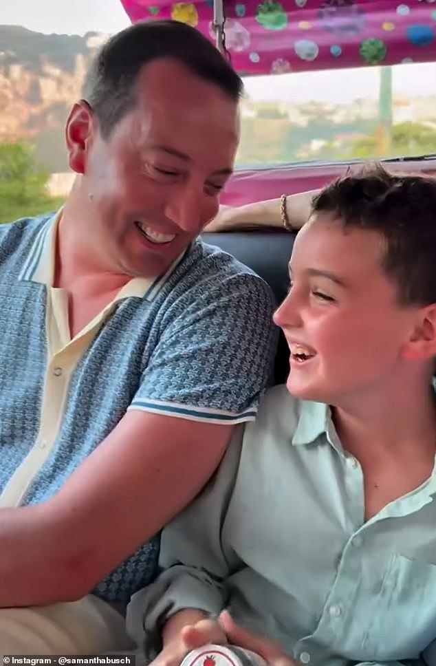 Kyle Busch holding his child in a tender father-child moment