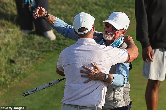 Clark celebrates with his father Randall, who surprised his son to fly in from Denver on Sunday