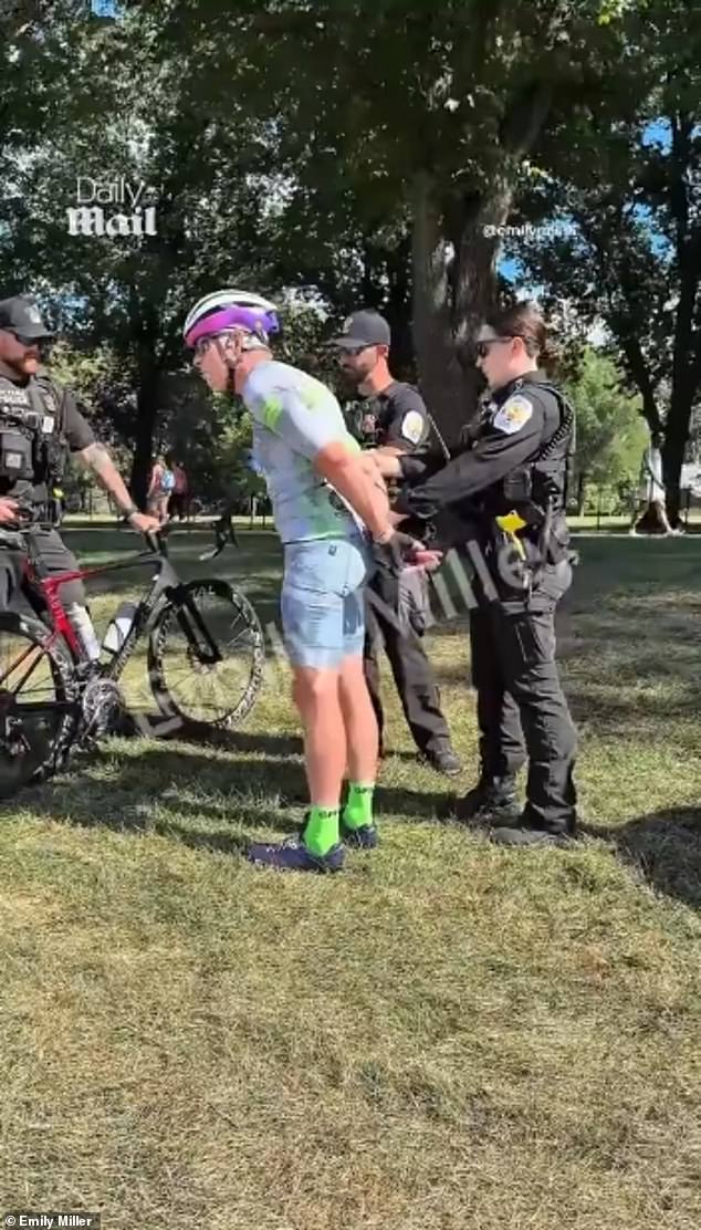 Hearn is pictured getting arrested by the Reflecting Pool on Friday