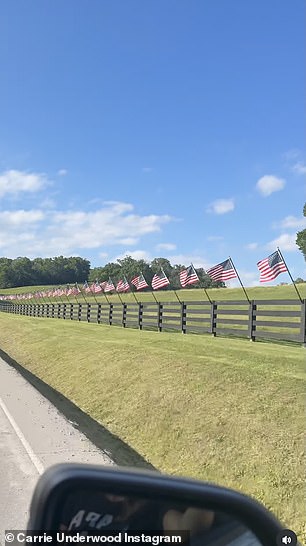 Fence lined with American flags on Carrie Underwood's Tennessee property