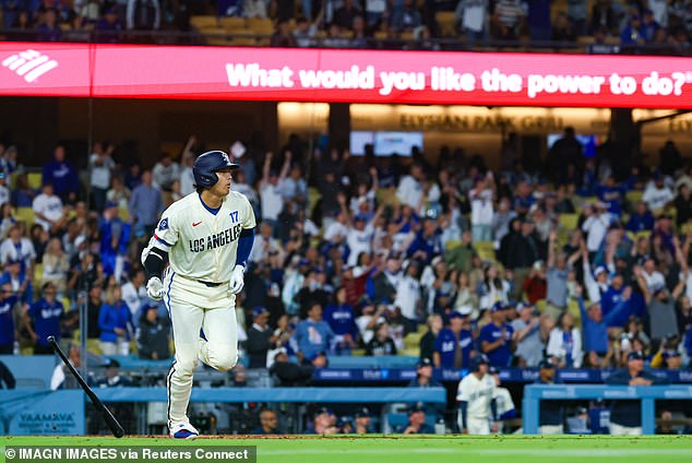 Shohei Ohtani hits a home run during the Dodgers' 12-1 loss to Baltimore