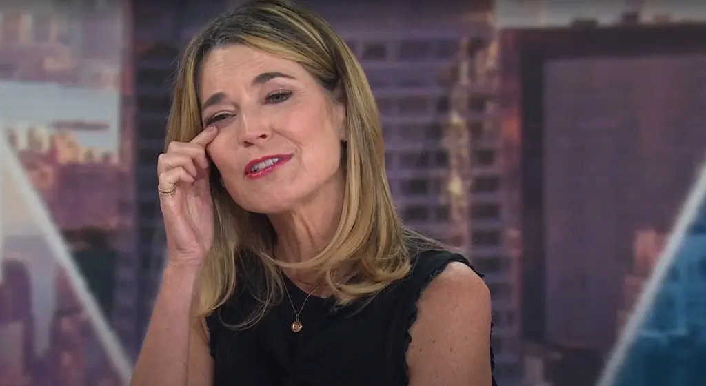 Savannah Guthrie wipes a tear from her eye on set.