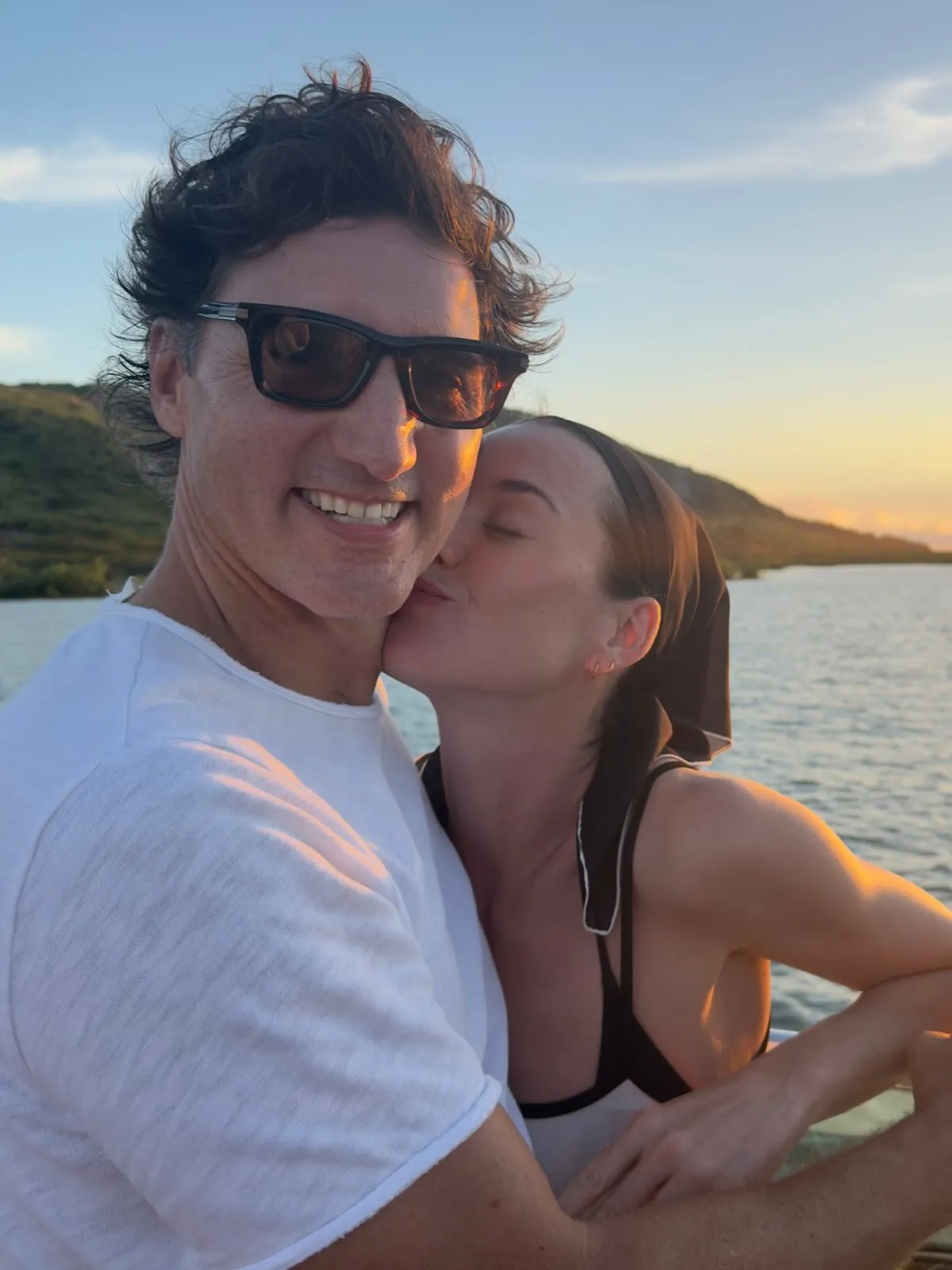 Katy Perry and Justin Trudeau embrace on the deck of her yacht, the Caravelle.