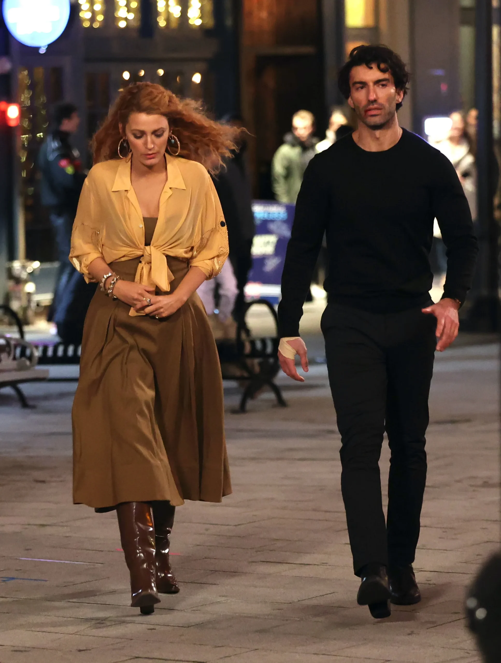 Blake Lively and Justin Baldoni walk together at night in New York City