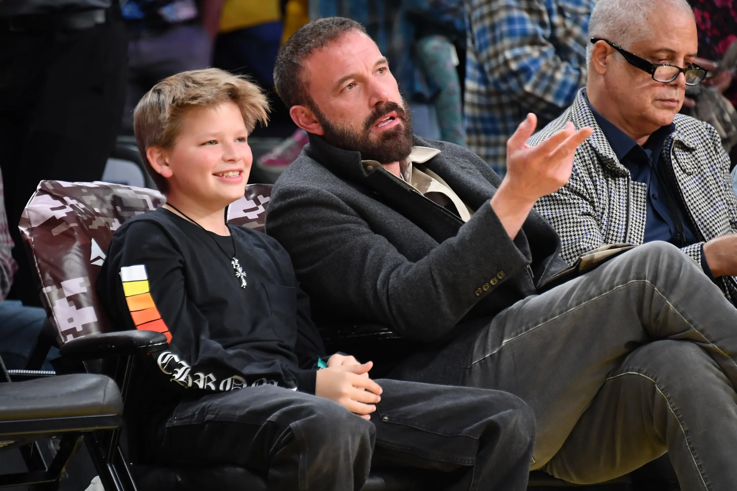 Ben Affleck and Samuel Garner Affleck watching a basketball game.