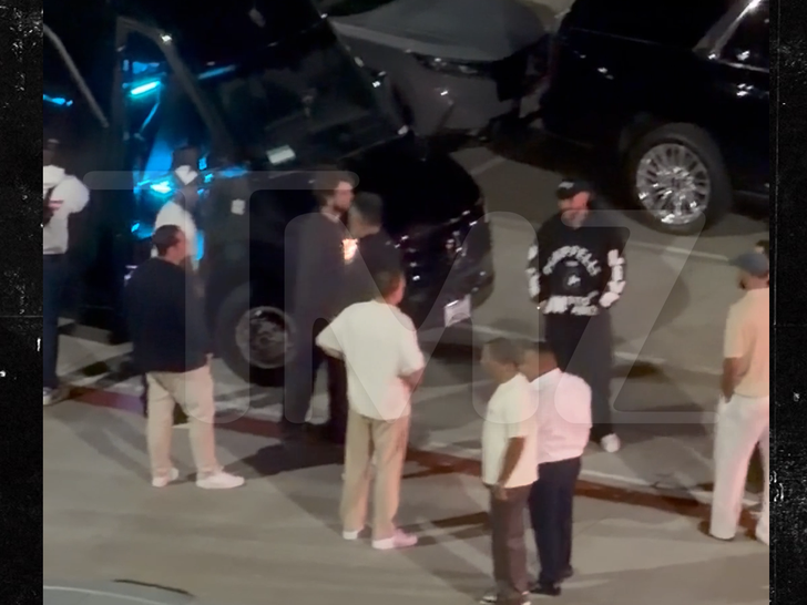 Travis Kelce and friends near a party bus after Dave Chappelle show in San Diego.