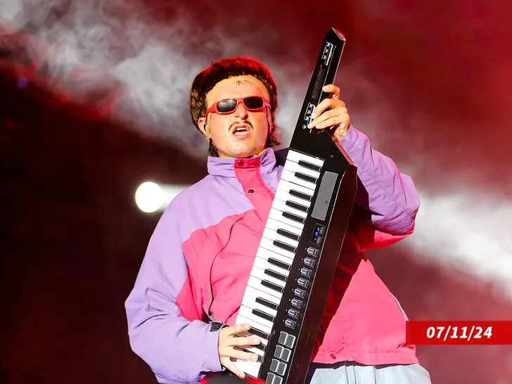 Oliver Tree performing live on stage.